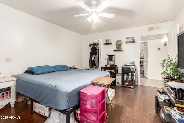 bedroom with dark wood-type flooring and ceiling fan