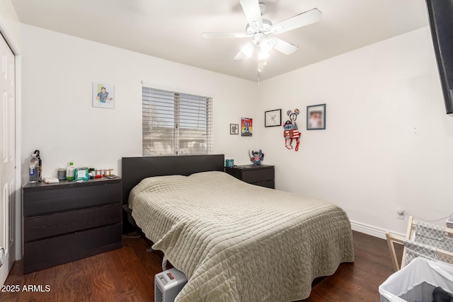 bedroom with dark wood-type flooring and ceiling fan