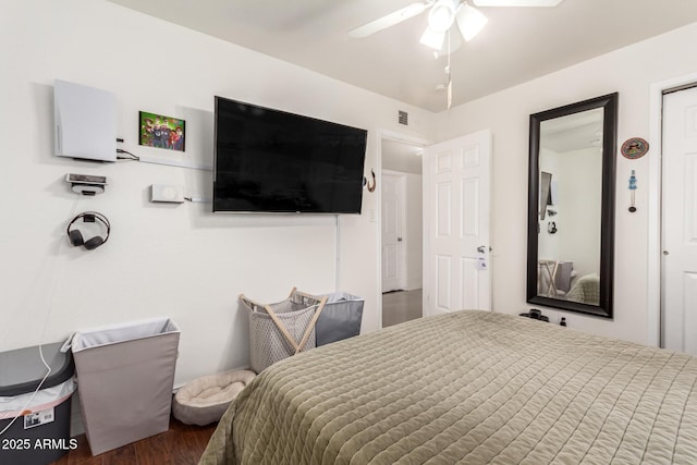 bedroom featuring dark hardwood / wood-style floors and ceiling fan