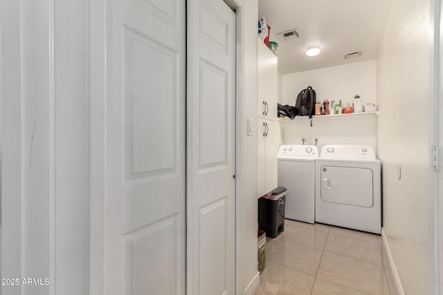 laundry room featuring separate washer and dryer