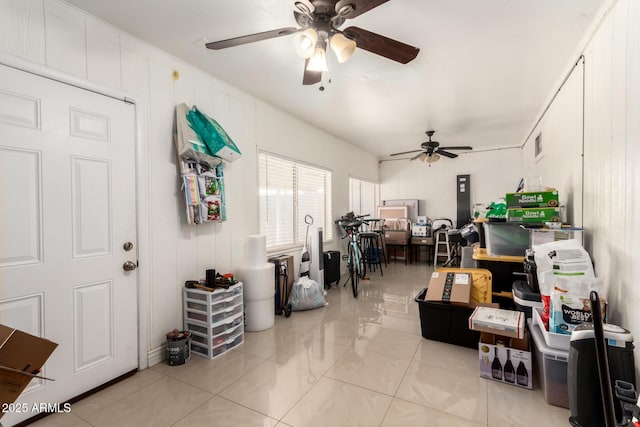 interior space with ceiling fan