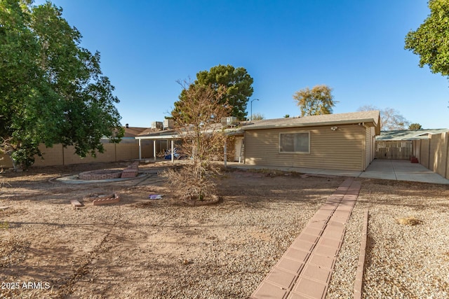 rear view of house featuring a patio