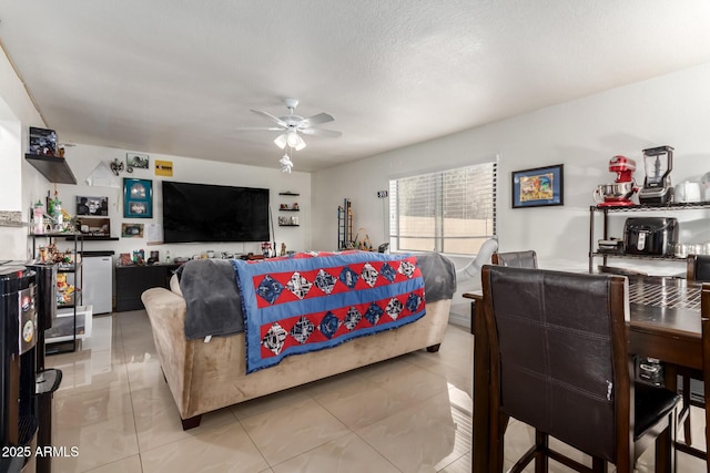 tiled bedroom featuring stainless steel refrigerator and a textured ceiling