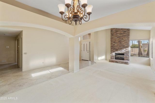 unfurnished living room with an inviting chandelier, a stone fireplace, high vaulted ceiling, and light carpet