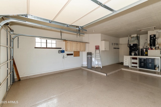 garage featuring heating unit and water heater