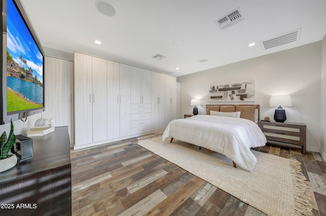 bedroom featuring dark hardwood / wood-style flooring