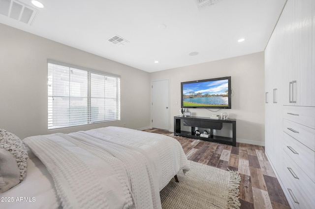 bedroom with wood-type flooring