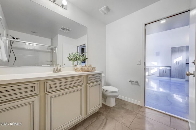 bathroom with vanity, toilet, and walk in shower