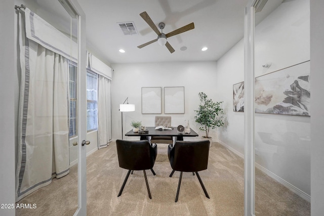 home office with ceiling fan and light colored carpet