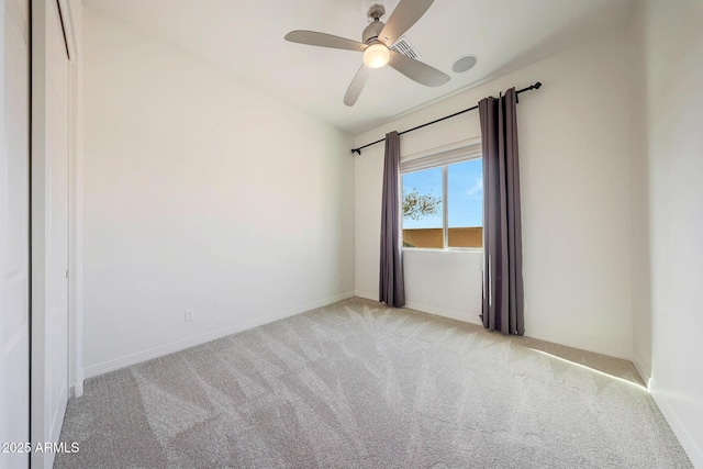 unfurnished room with light carpet and ceiling fan