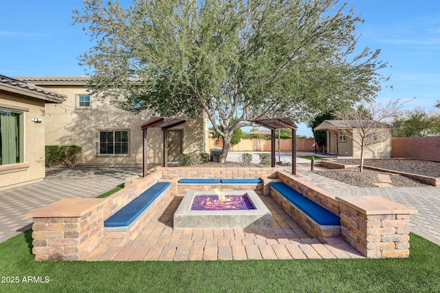 view of swimming pool with a storage unit, a pergola, a patio area, and a fire pit