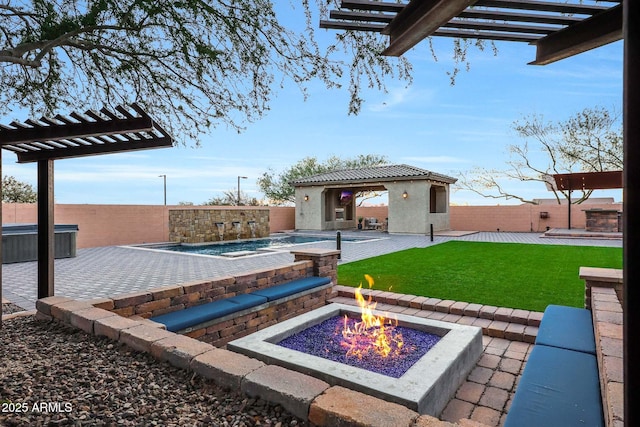 exterior space featuring a patio area and a fire pit