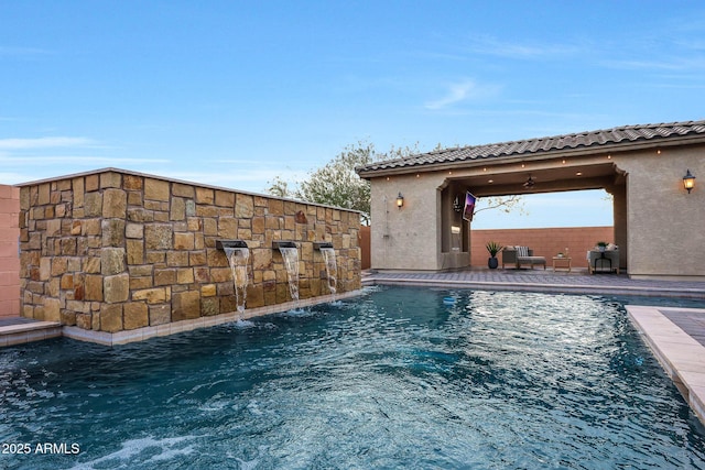 view of swimming pool featuring pool water feature