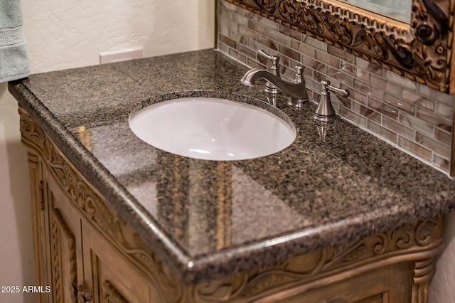 bathroom with vanity and backsplash