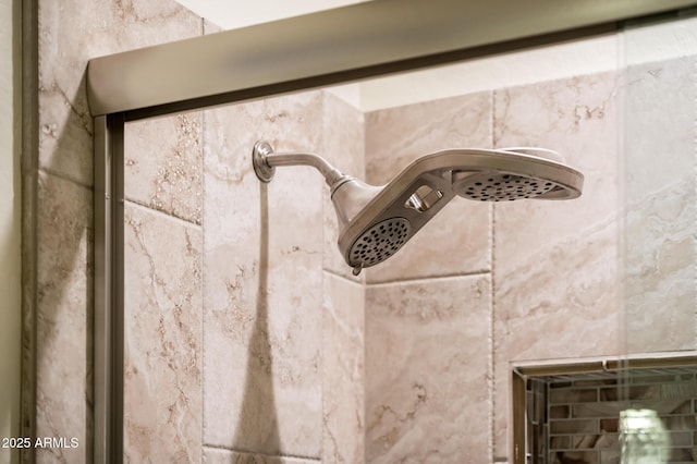 interior details with a tile shower