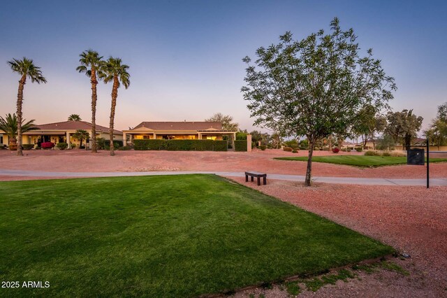 view of property's community featuring a lawn