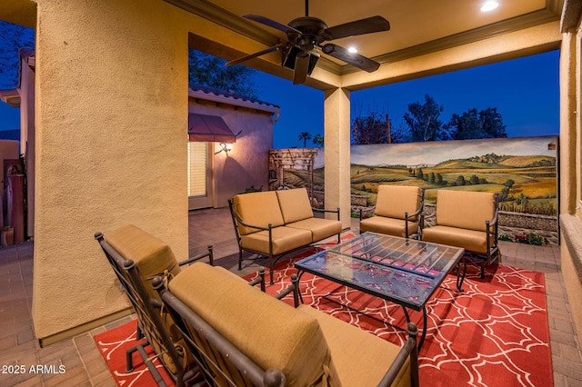 patio at twilight with an outdoor hangout area and ceiling fan