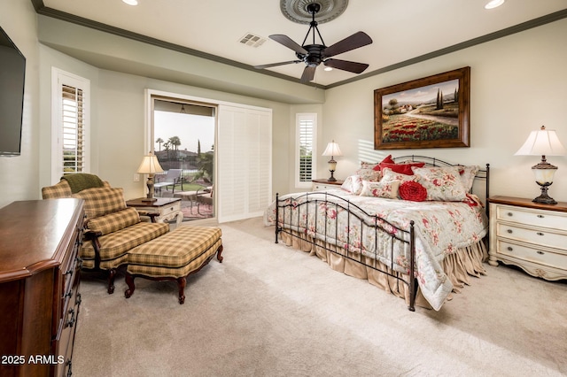 carpeted bedroom featuring visible vents, recessed lighting, crown molding, and a ceiling fan