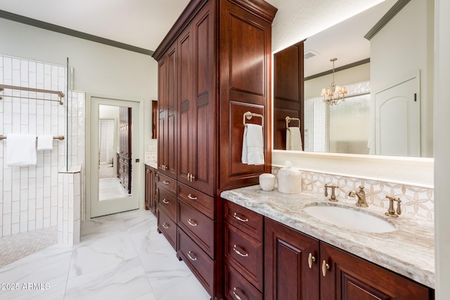 bathroom featuring walk in shower, marble finish floor, ornamental molding, and vanity