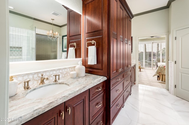 full bath with visible vents, a walk in shower, ornamental molding, a notable chandelier, and vanity