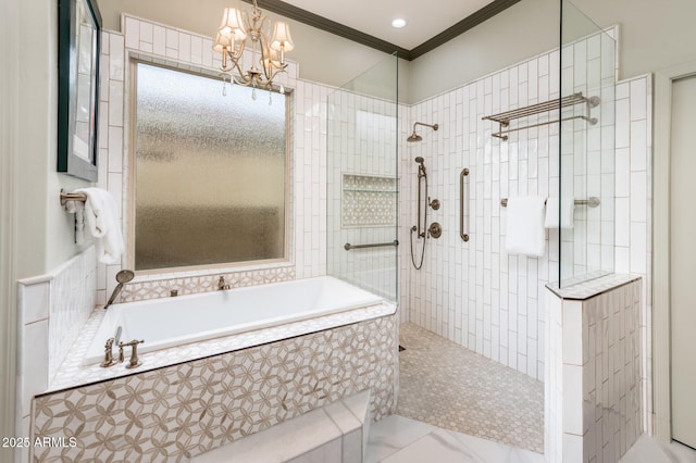 bathroom with an inviting chandelier, a bath, a tile shower, and ornamental molding