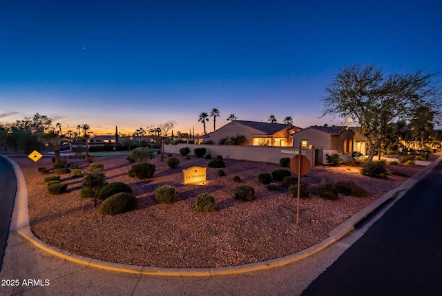 view of front of home with fence