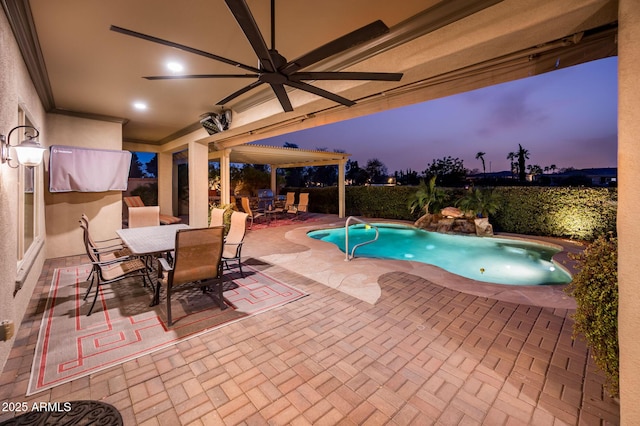 pool at dusk featuring a patio area, a fenced in pool, outdoor dining area, and ceiling fan