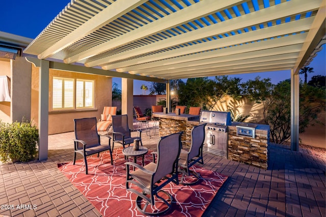 view of patio featuring area for grilling, fence, a pergola, and grilling area