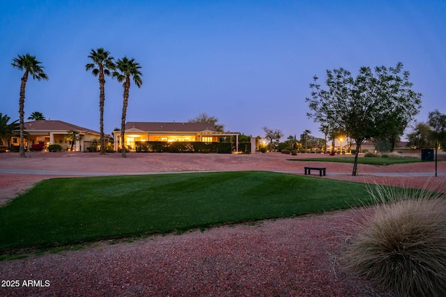 view of home's community featuring a lawn