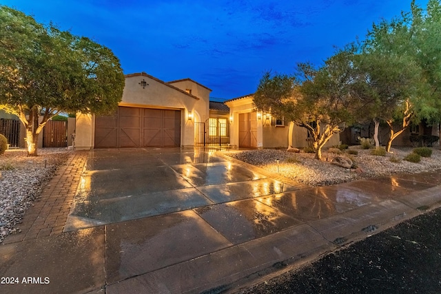 mediterranean / spanish-style house featuring a garage