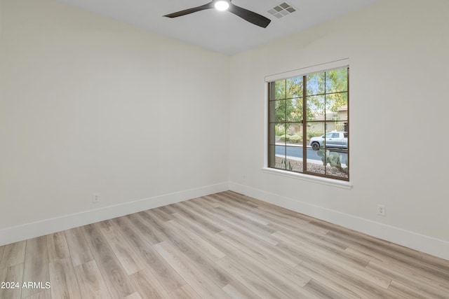 empty room featuring ceiling fan and light hardwood / wood-style floors