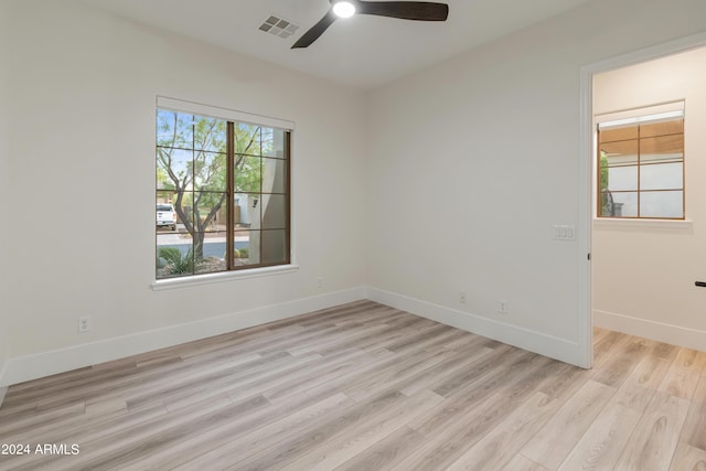 unfurnished room featuring ceiling fan and light wood-type flooring