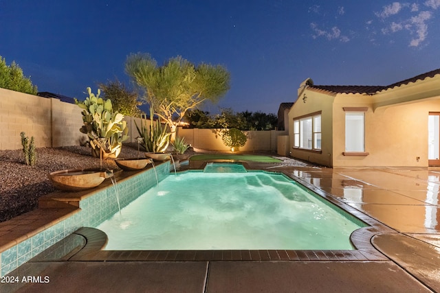 view of swimming pool with pool water feature