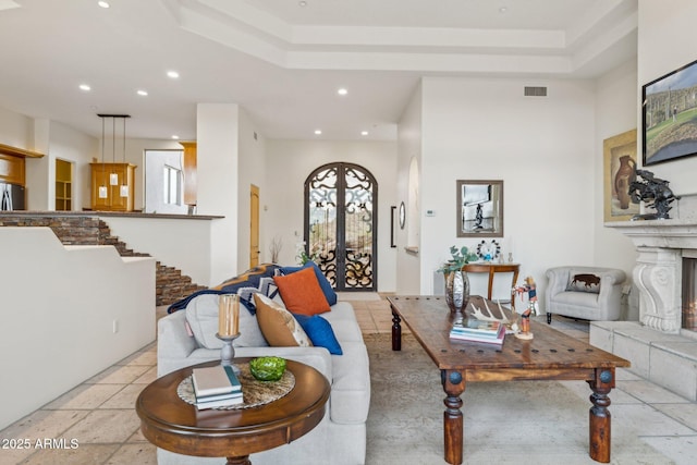 living room with a tray ceiling