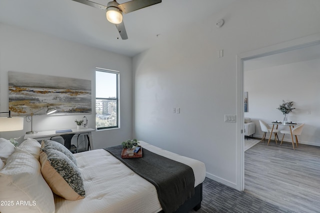 bedroom featuring hardwood / wood-style flooring and ceiling fan