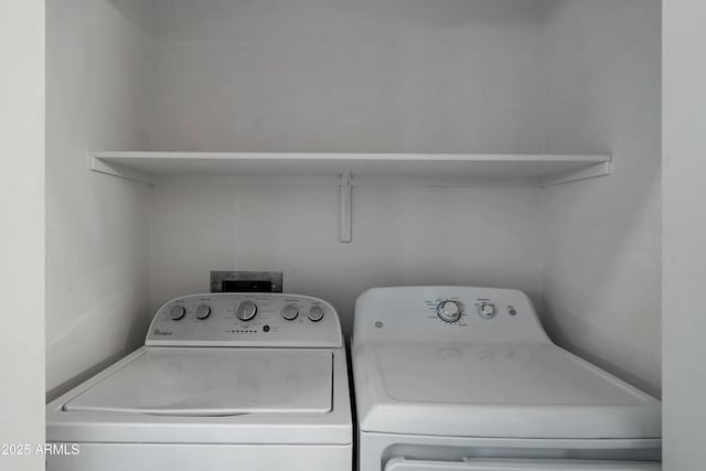 laundry area with washing machine and clothes dryer