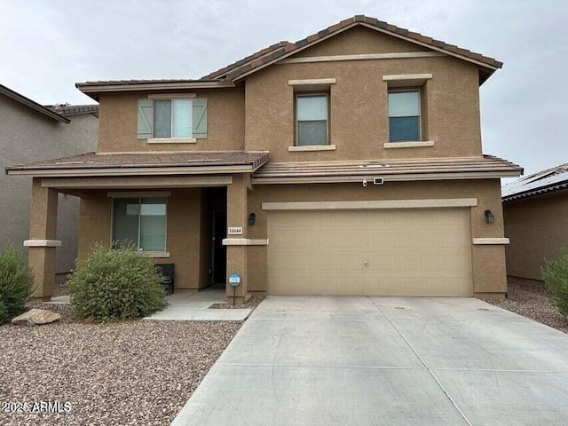 11644 W Redfield Rd, El Mirage, AZ 85335 - traditional home with a garage, stucco siding, a tile roof, and concrete driveway