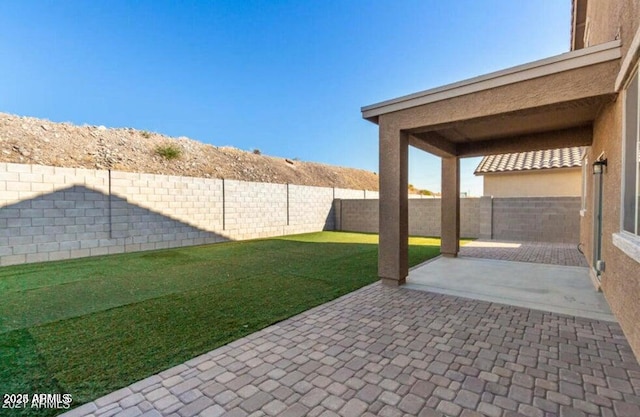 11644 W Redfield Rd, El Mirage, AZ 85335 - view of yard featuring a fenced backyard and a patio area