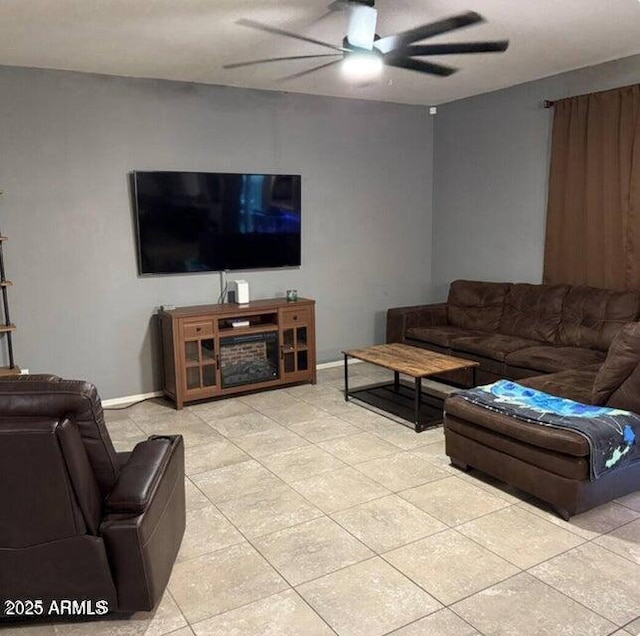 11644 W Redfield Rd, El Mirage, AZ 85335 - living area featuring a ceiling fan, baseboards, and light tile patterned floors