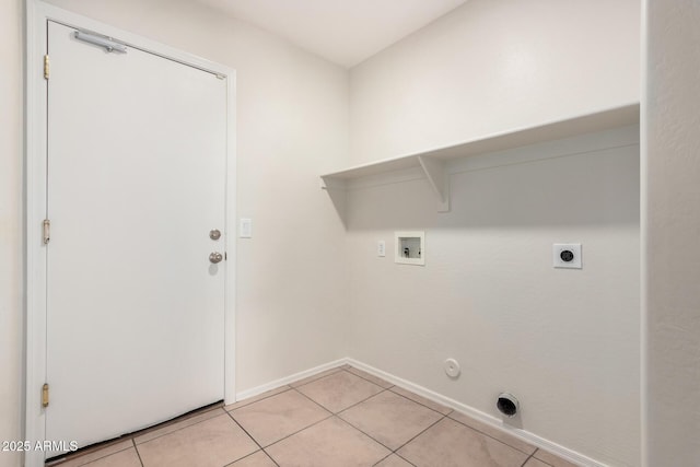 clothes washing area featuring washer hookup, hookup for a gas dryer, light tile patterned flooring, electric dryer hookup, and laundry area