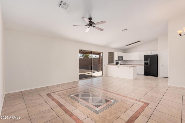 kitchen with black appliances, visible vents, light countertops, and light tile patterned flooring