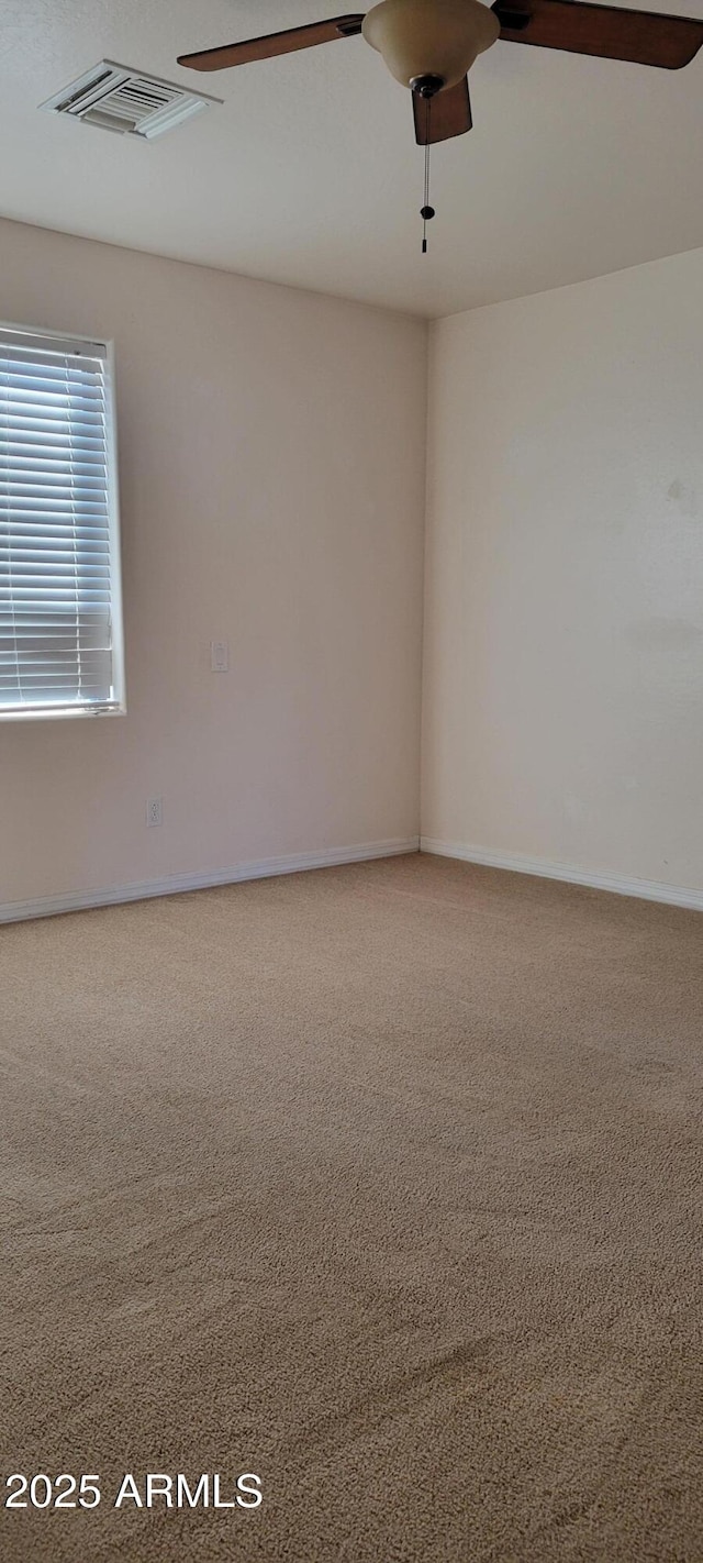 321 S Bridge St, Superior, AZ 85173 - empty room with carpet flooring and ceiling fan