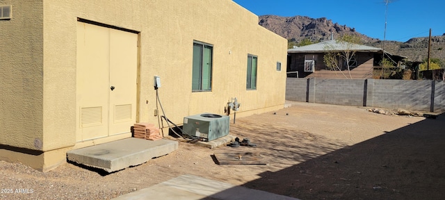 321 S Bridge St, Superior, AZ 85173 - view of property exterior featuring central AC unit and a mountain view