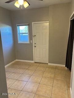 tiled foyer entrance featuring ceiling fan