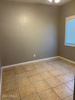 unfurnished room with light tile patterned floors