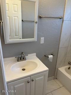 bathroom with vanity and  shower combination