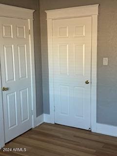 entryway with dark wood-type flooring