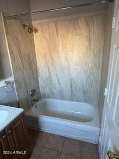 bathroom featuring vanity, tile patterned floors, and  shower combination