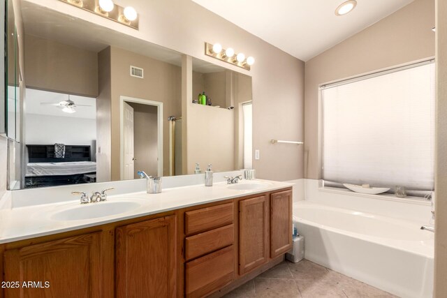 bathroom featuring visible vents, tile patterned flooring, double vanity, connected bathroom, and a bath