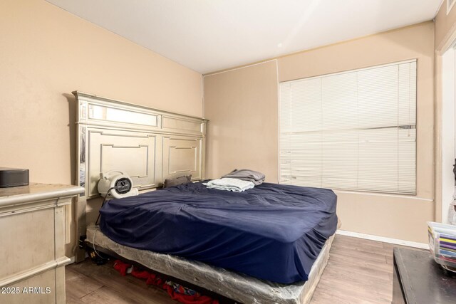 bedroom featuring light wood-style flooring